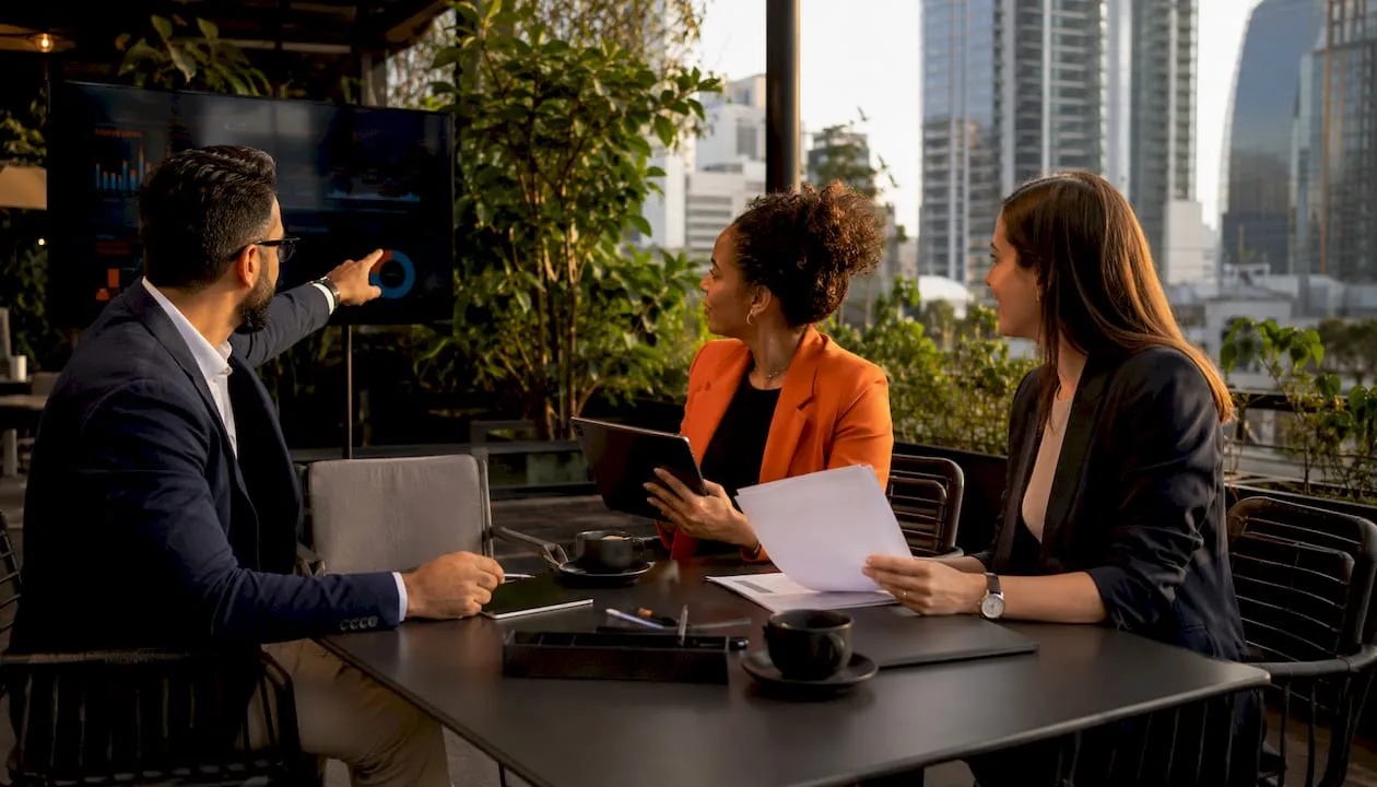 Team discussing automated sync in modern office